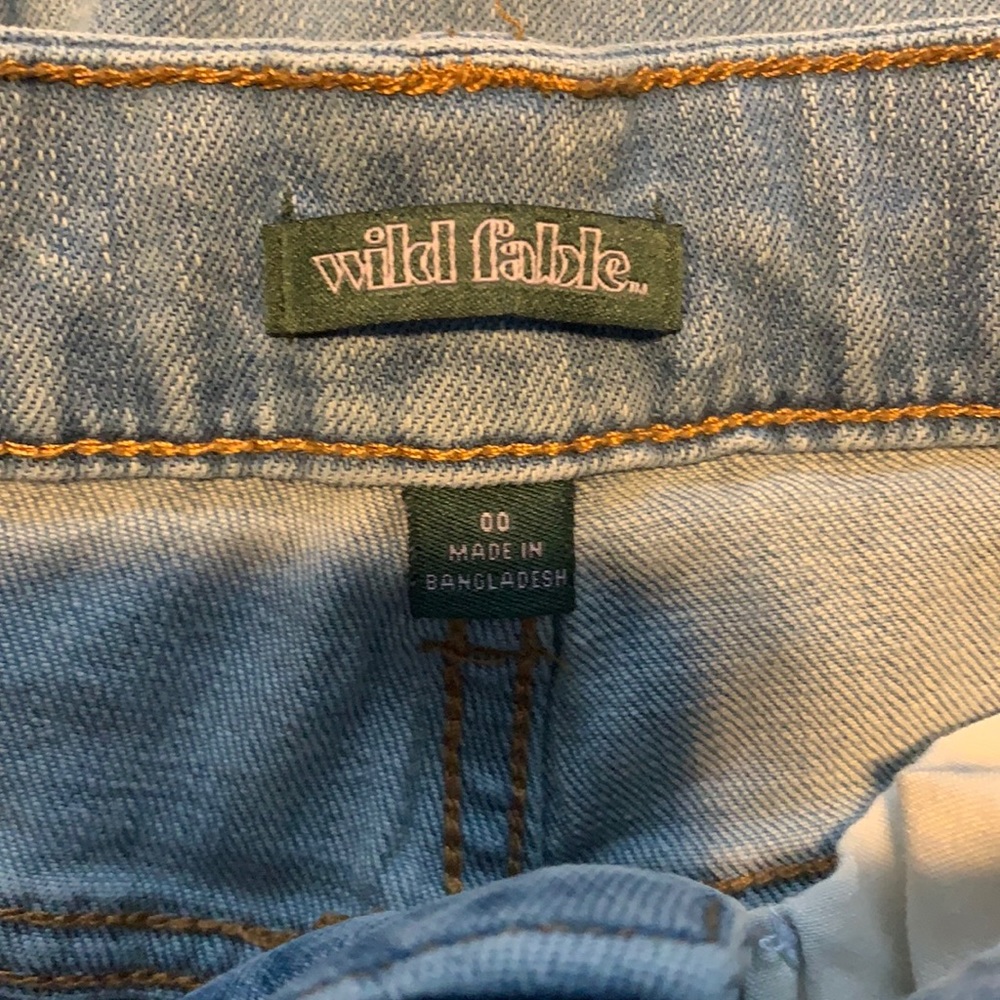 high rise ripped light wash jeans
